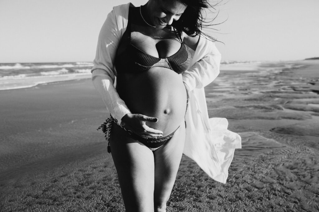 Pregnant mother at the beach. Black and white photo.
essential vitamins for pregnancy
