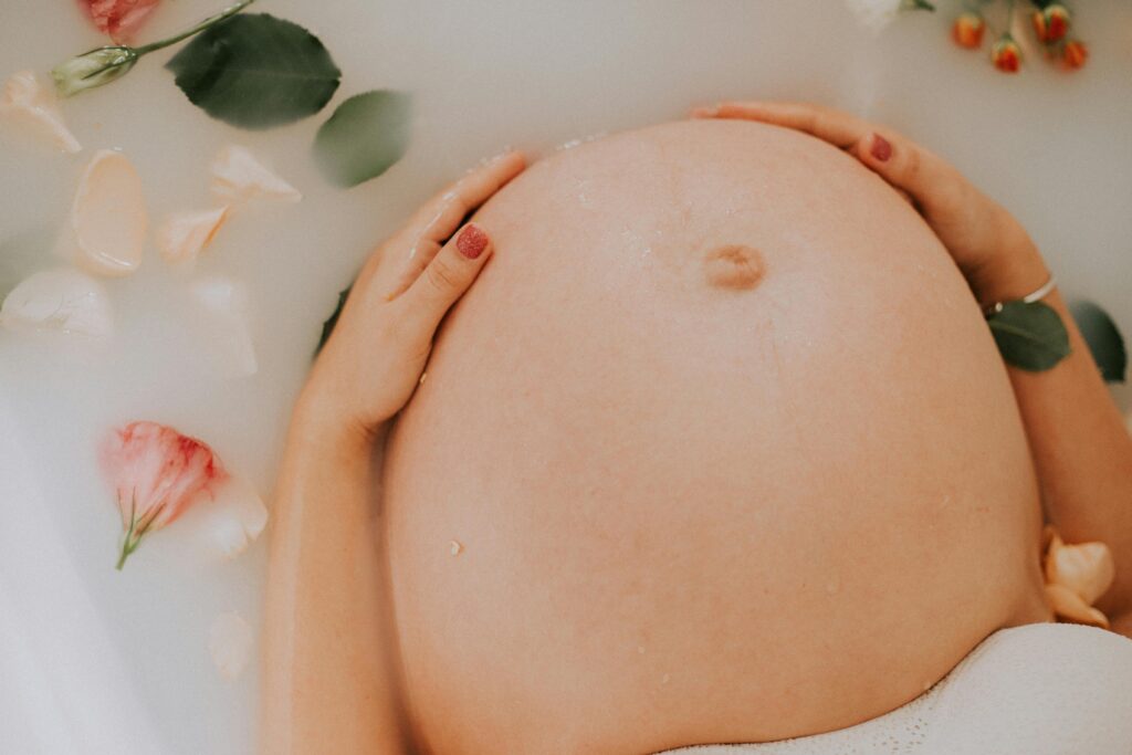 Pregnant woman laboring in the tub