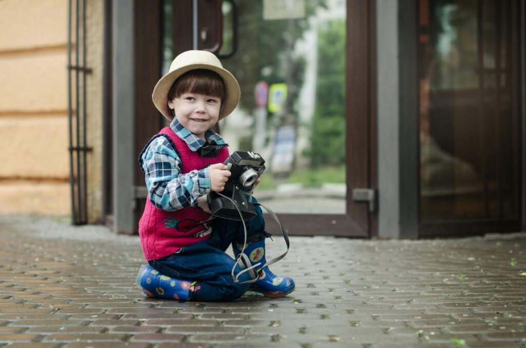 Boy with a play camera
