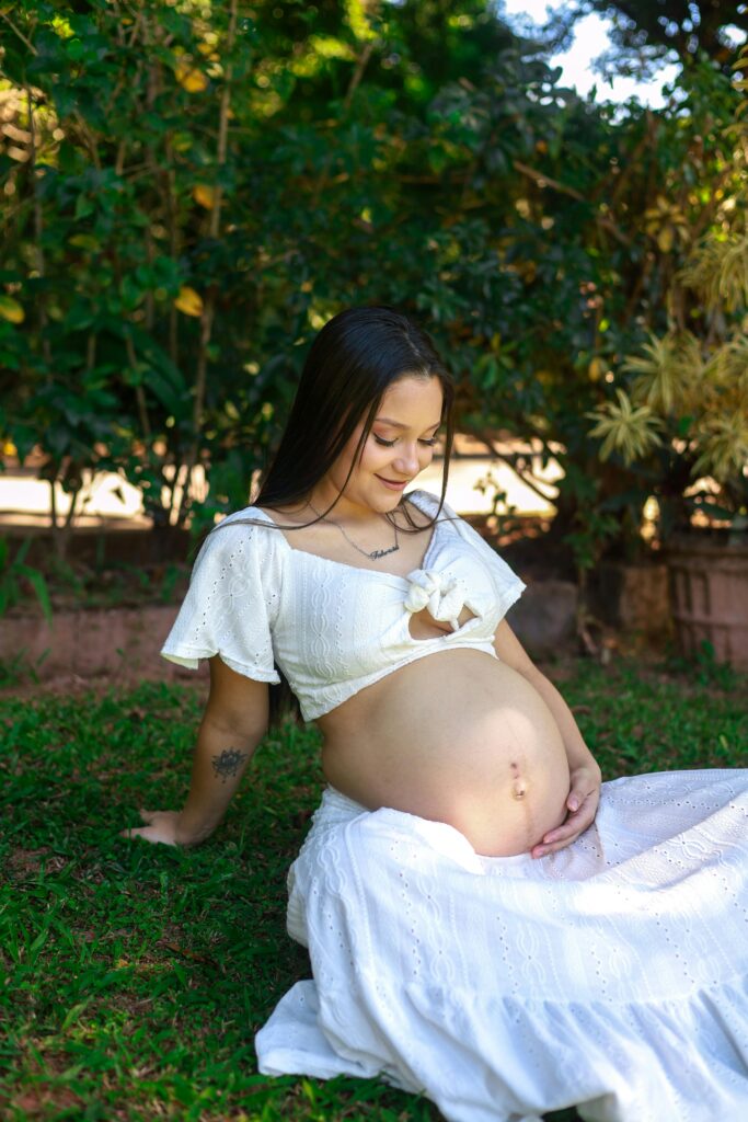 Pregnant woman outside in nature 